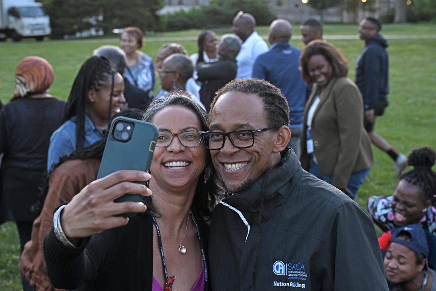 Alumni taking selfies at Reunion 2024