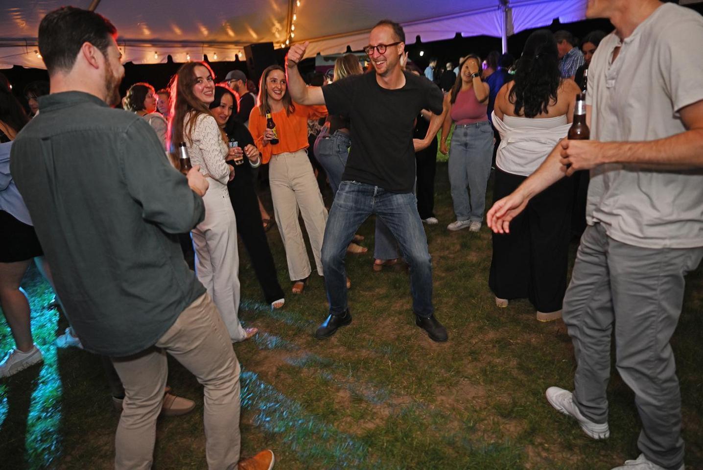 Alumni dancing under the tent at Reunion 2024