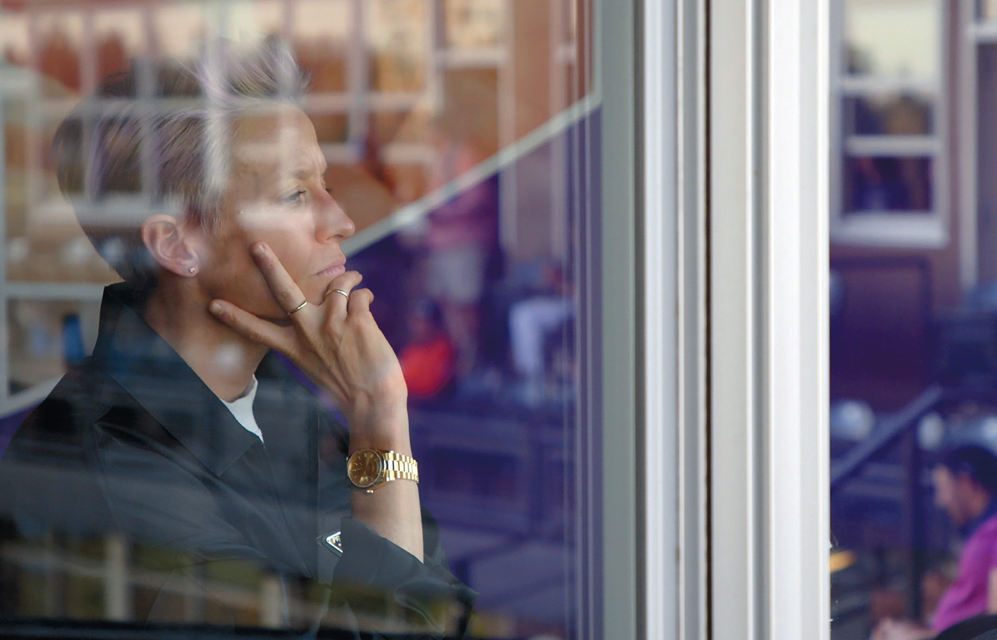 Image of Megan Rapinoe looking out a window