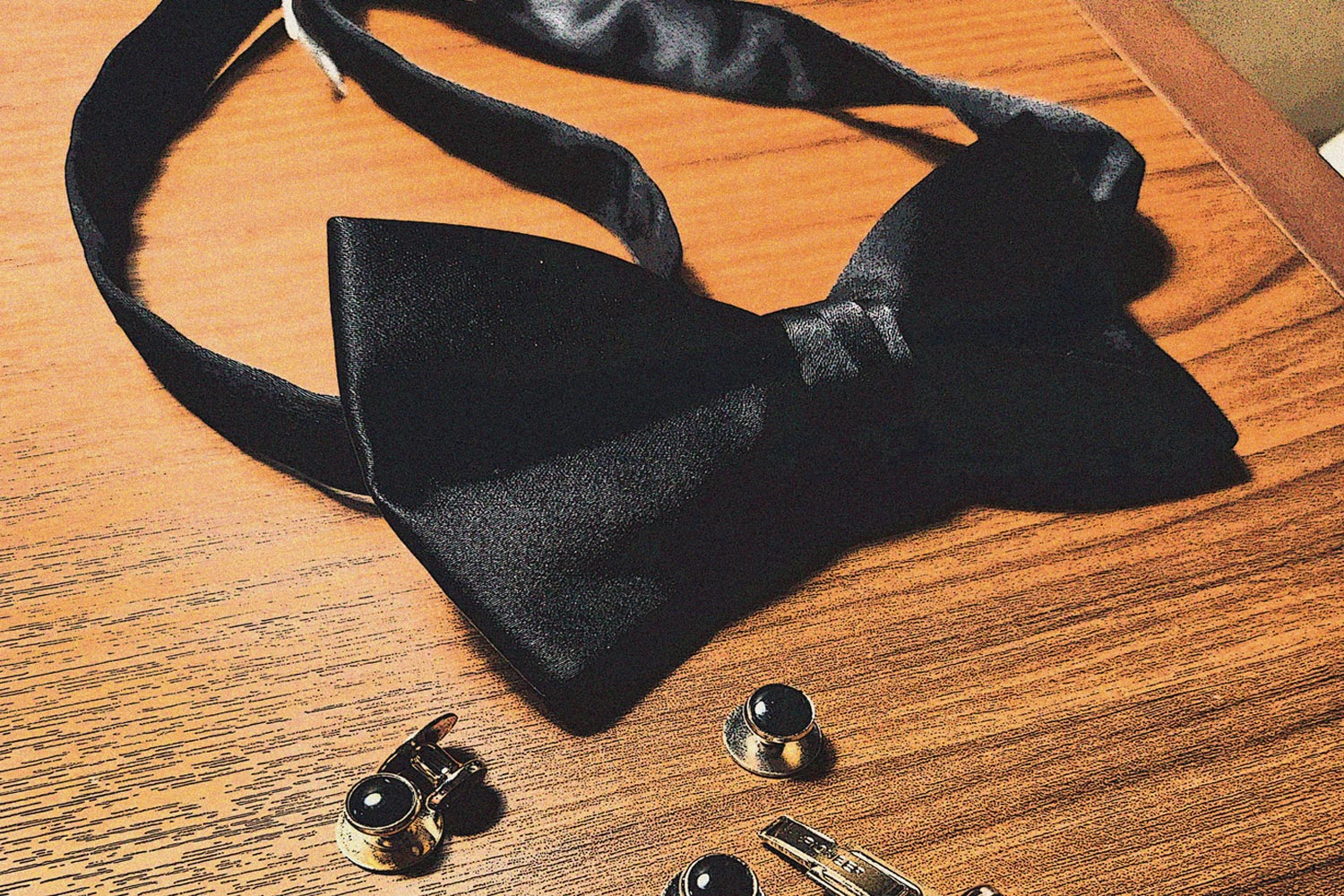 Abstract image of a bow tie and cuff links