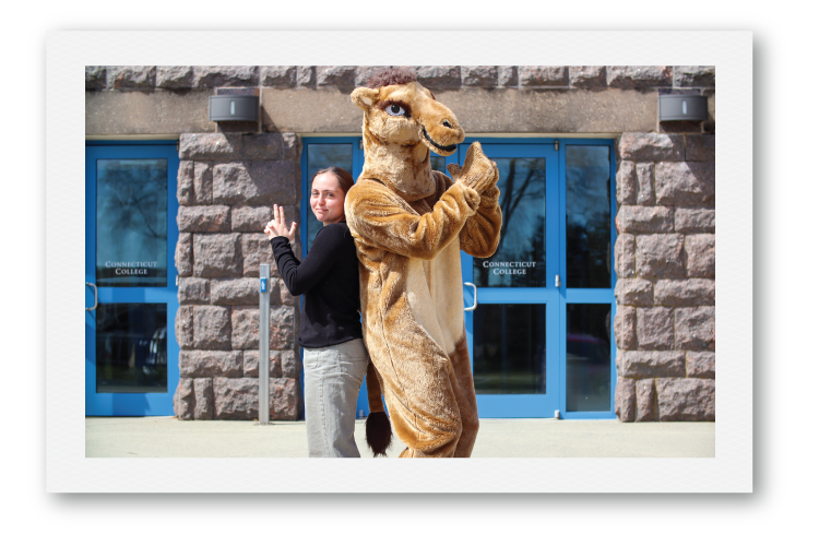 Student back-to-back posing with Camel mascot