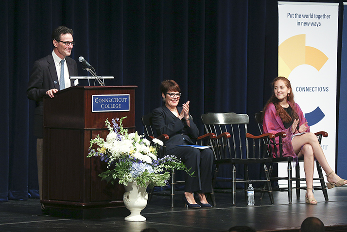 Dean Jefferson Singer addresses new students and parents while the President and SGA President look on.