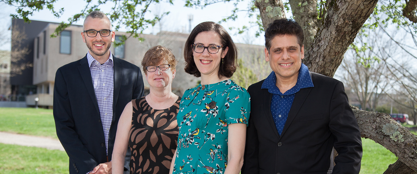 A group photo of Professor Ross Morin, Tristan Borer, Virginia Anderson, Sunil Bhatia