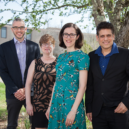 A group photo of Professor Ross Morin, Tristan Borer, Virginia Anderson, Sunil Bhatia