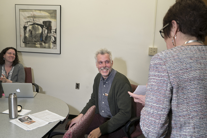 President Katherine Bergeron surprises Research and Instruction Librarian Andrew Lopez with the Student Support Award. 