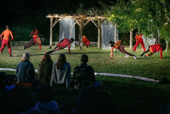 Dancers perform Reach, a work choreographed by Lisa Race, in the Arboretum.