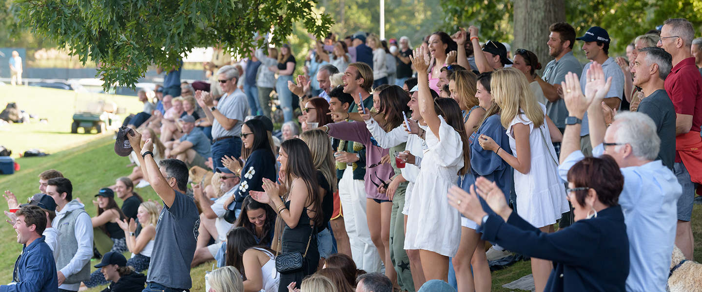 The crowd cheers during a Conn soccer match.