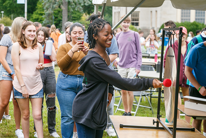 A student rings the gong. 