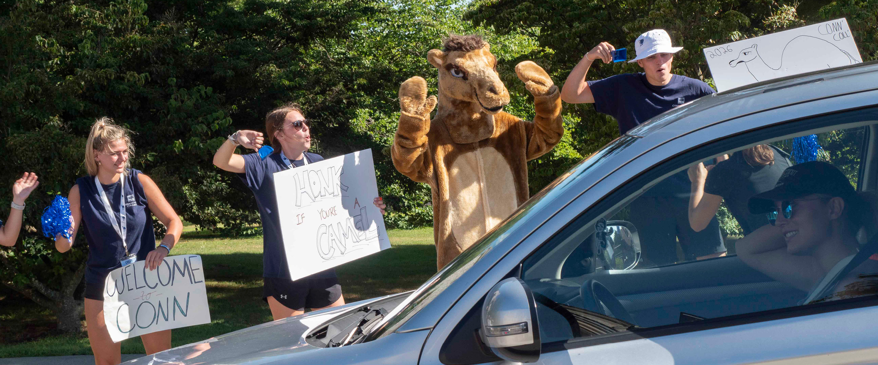 Students cheer as members of the new class arrive