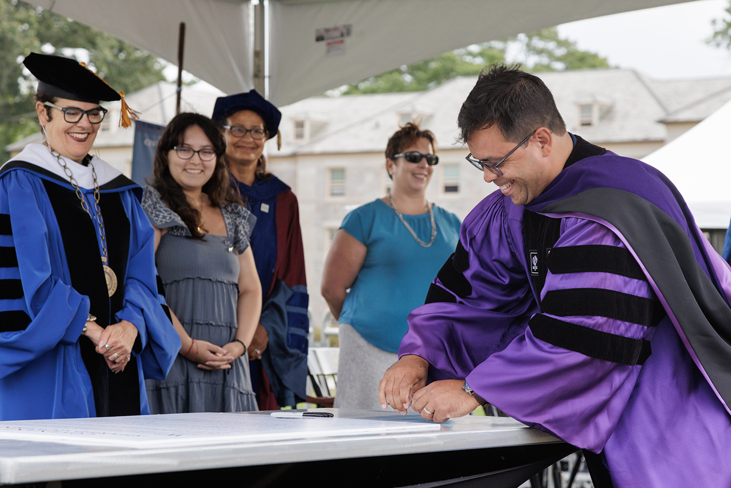 Board of Trustees Chair Debo Adegbile '91 signs the Shared Governance Covenant.