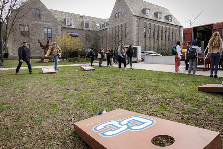 Students play corn hole.