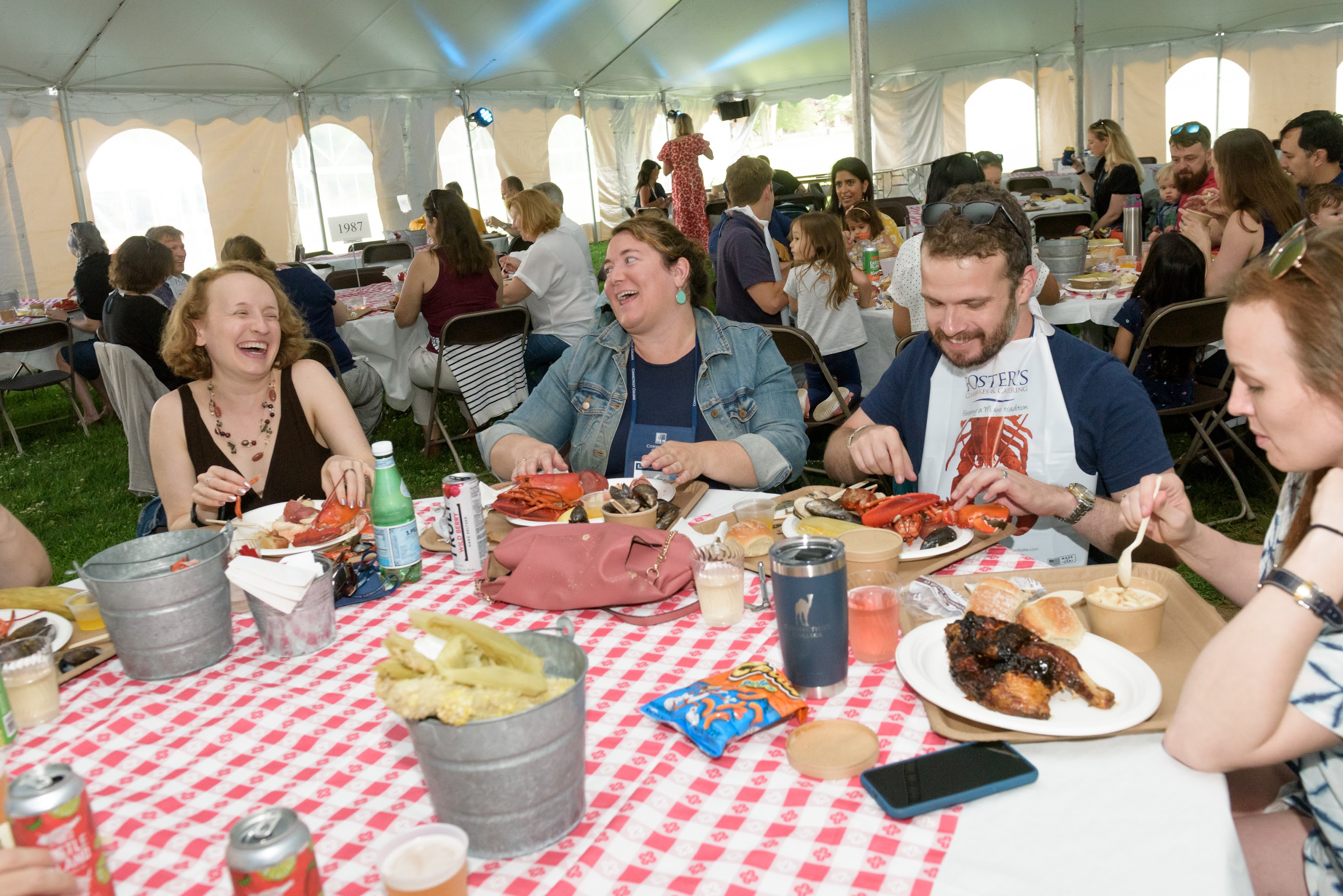 Friends enjoy the annual Classic New England Style Lobsterbake on Friday afternoon.