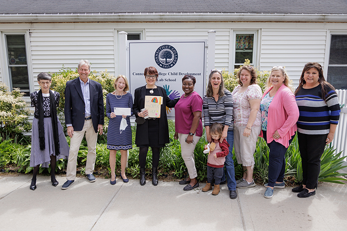 Teachers and administrators from the Lab School pose for a photo with President Bergeron.