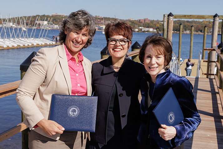 Jessica Archibald ’95, President Katherine Bergeron and Emeritus Trustee Barbara Zaccheo Kohn ’72 at the waterfront ribbon cutting