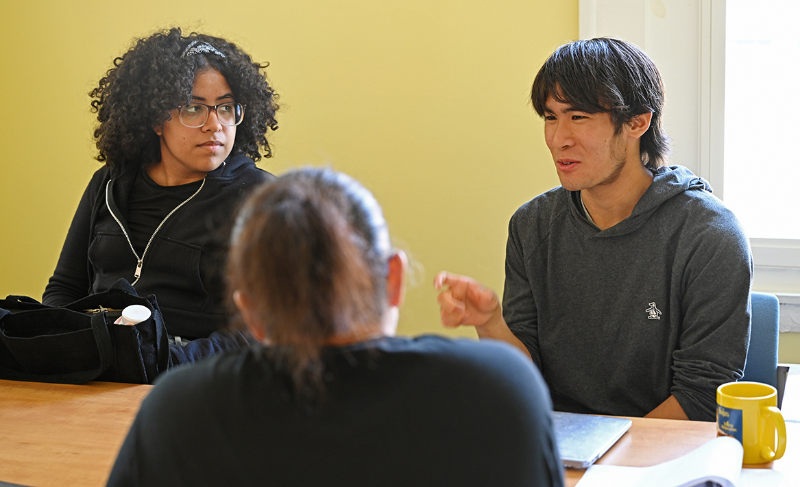 Civic Leaders students Kevin Lieue ’26 and Danisha Then ’25 meet with staff of the New London Homeless Hospitality Center