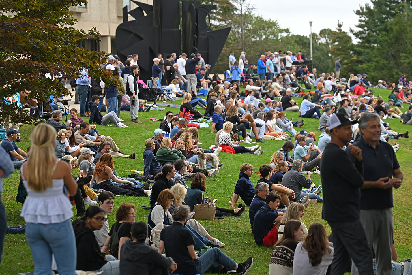 A crowd watches soccer on the Green at Fall Weekend 2023