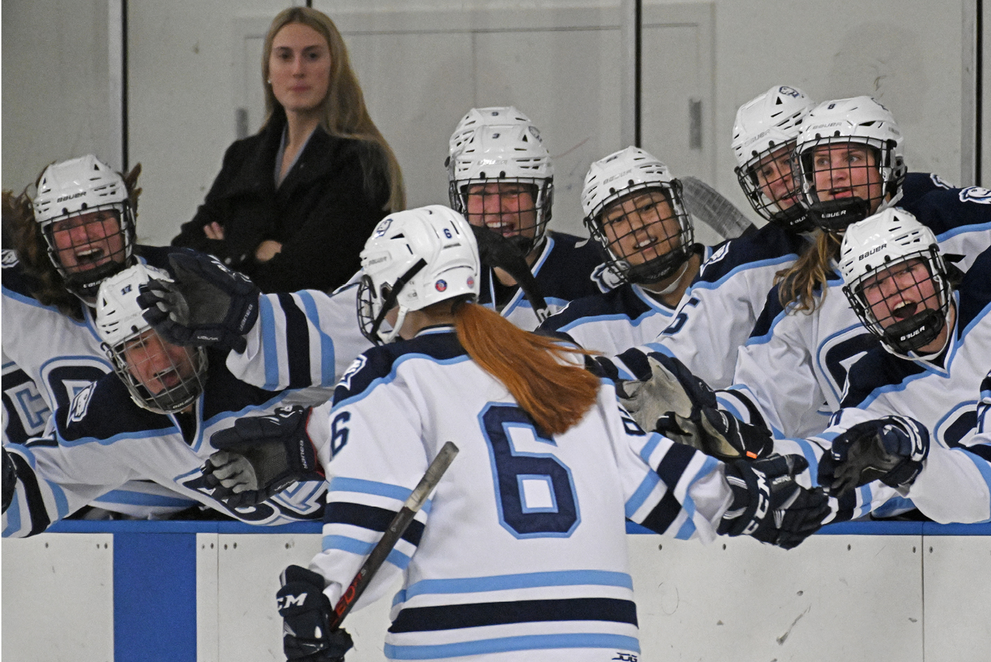 The Connecticut College Camels bench congratulates forward Bridget McGann '26 on a goal vs. Bowdoin College.