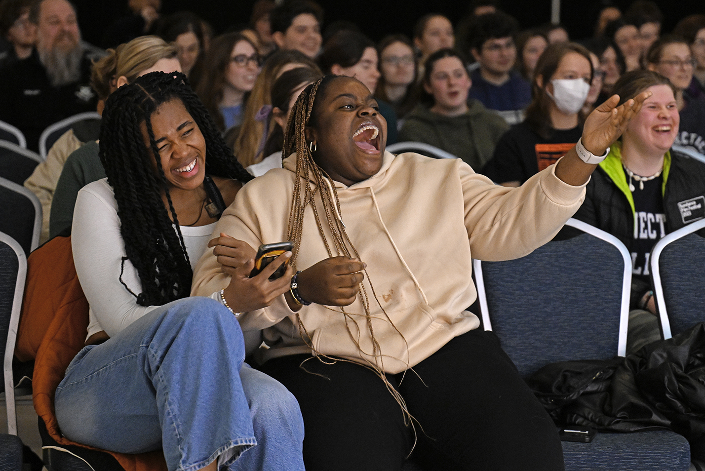 Two students laughing